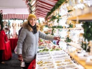 Visitors shopping for gifts at the Aurora Christkindlmarket for gifts and unique trinkets for the holidays.