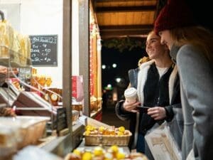 Visitors shopping for unique gifts at the Christkindlmarket Aurora.