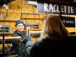 Visitors enjoying food vendors at the Christkindlmarket Aurora.