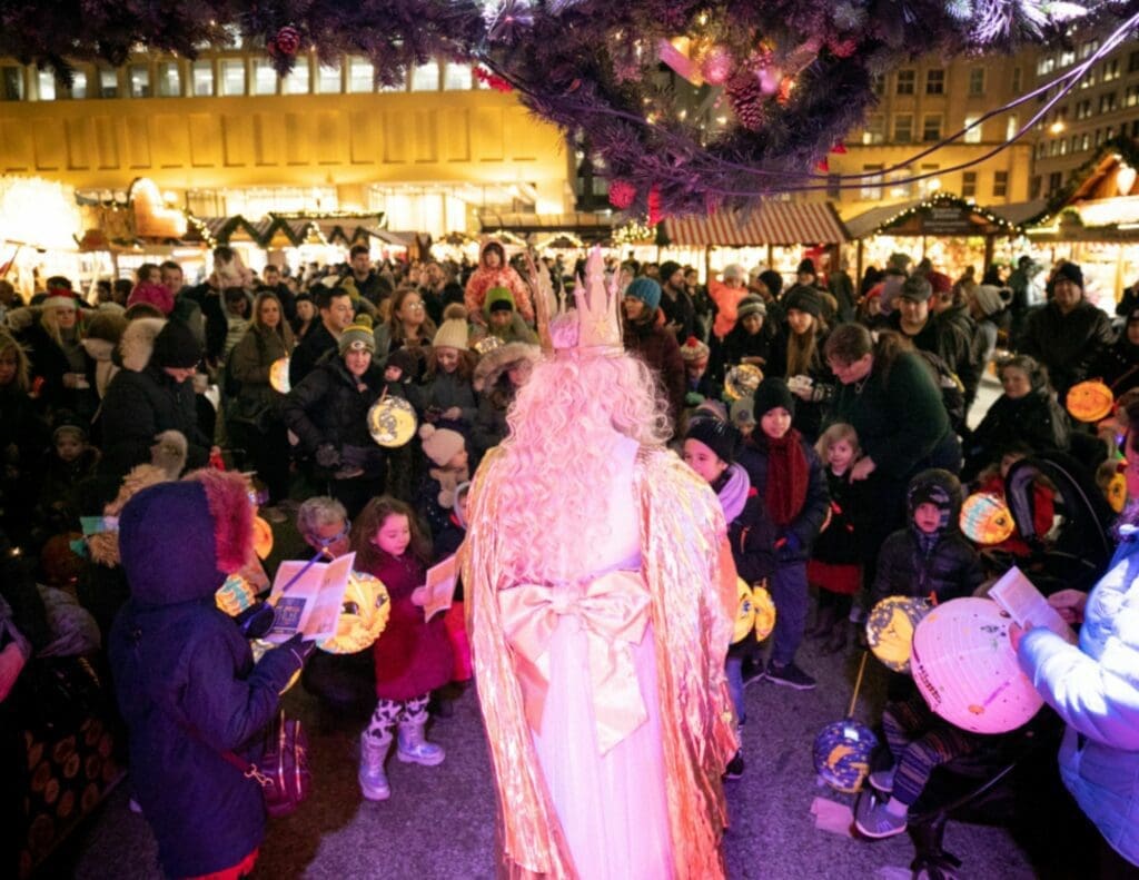 Children can join the Christkind for a lantern parade and sing German and English holiday songs