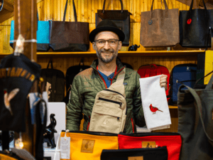 Holiday vendor selling hand and shoulder bags