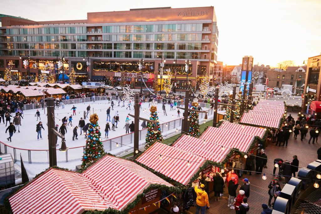 Visitors ice skating at the ice rink at the Christkindlmarket Wrigleyville.