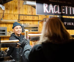 Visitors enjoying food vendors at the Christkindlmarket Aurora.