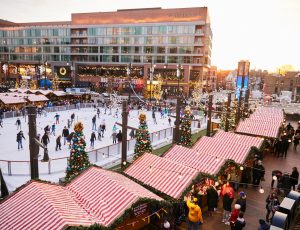 Visitors ice skating at the ice rink at the Christkindlmarket Wrigleyville.